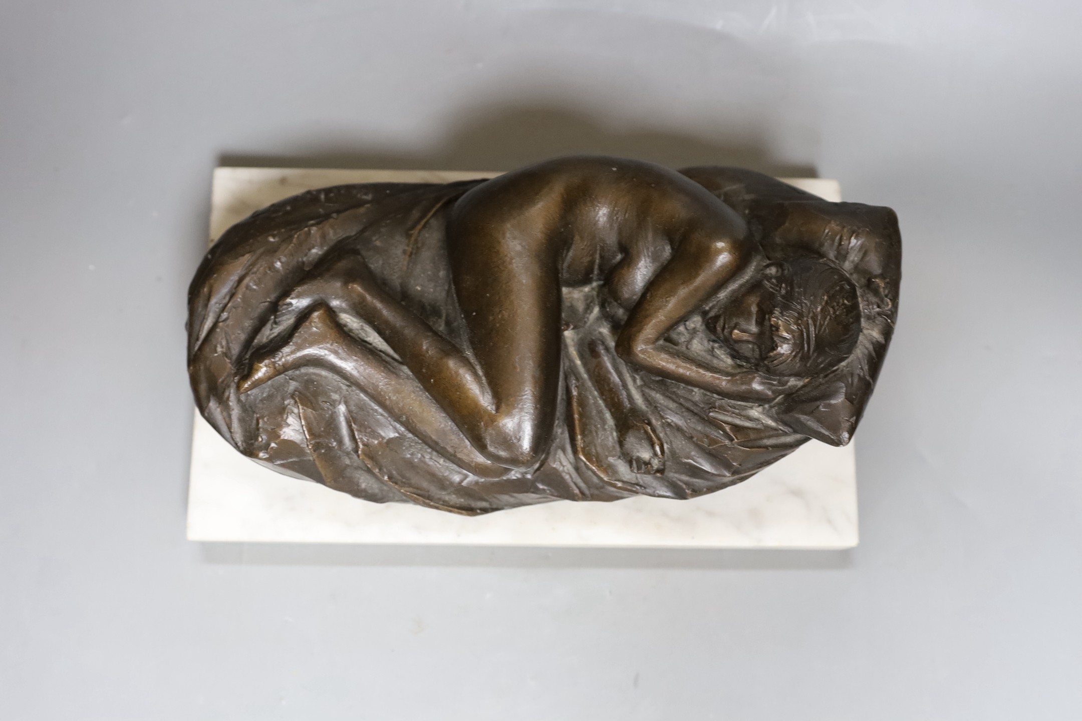 James Butler R.A. (1931-2022) A bronze reclining nude, 'Butler, 77'on a white marble plinth, total length 30.5 cm